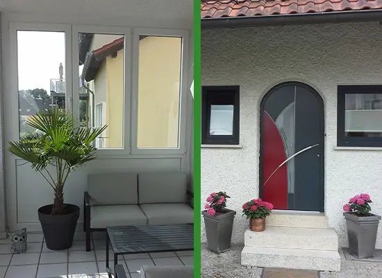 Weiße Fenster im Wintergarten und moderne graue Haustür mit rotem Glaseinsatz